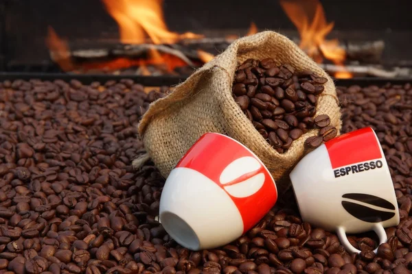 Two Cups of Espresso and Coffee Beans on a Background of Fire — Stock Photo, Image