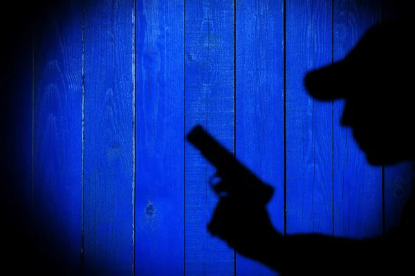 Тень человека с пистолетом, изображение XXXL — стоковое фото