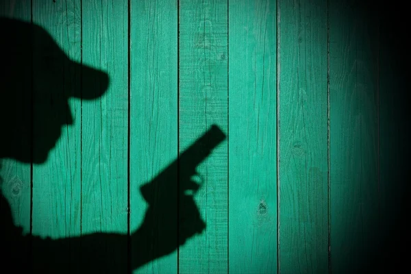 Shadow of a man with a gun, XXXL image — Stock Photo, Image