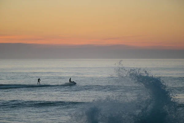 Jet Ski Towing Foil Surfer Sunset Atlantic Ocean — стоковое фото