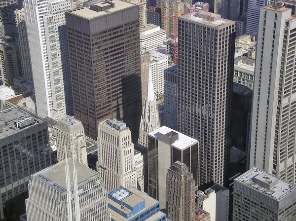 Little church between skyscrapers — Stock Photo, Image