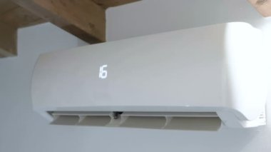 Air conditioner system working to refresh house rooms from summer heat, domestic appliances energy consumption. 4k