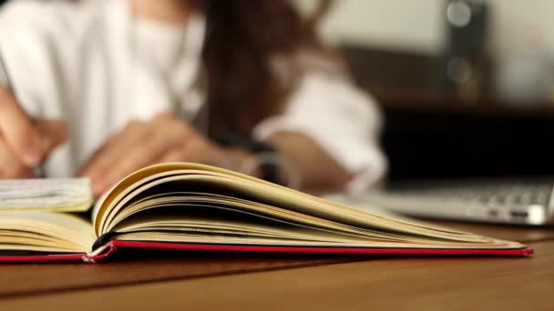 Focus Book Unknown Female Student Making Notes Using Laptop Online — Vídeos de Stock