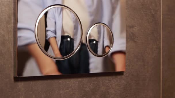 Female Hand Pressing Silver Toilet Flush Button Wall Using Reflaction — Stock videók