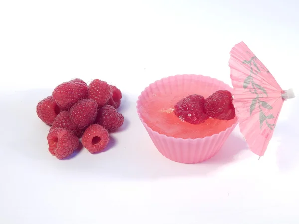 Gelatina di lampone in un bicchiere e lamponi — Foto Stock