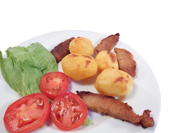 Batatas assadas e carne de porco assada — Fotografia de Stock