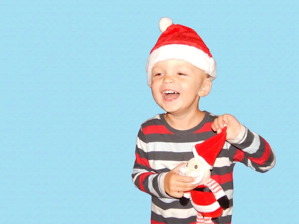 Ребенок с Санта-Клаусом в руках смеется, Новый год, Рождество — стоковое фото
