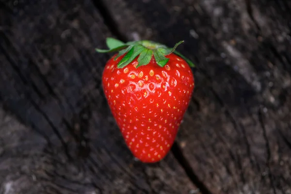 Appetizing Strawberries Old Dark Wooden Background Close — Stok fotoğraf