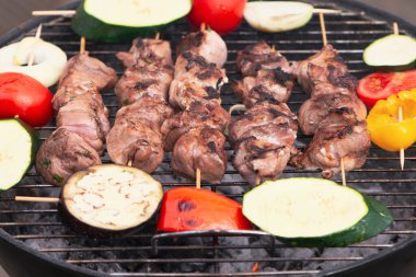 appetizing pork neck meat is cooked on the grill with vegetables