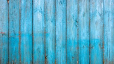 Eski mavi ahşap arka planda eski tarz çatlaklar ve çizikler