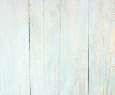 Eski mavi ve gri ahşap arka planda eski tarz çatlaklar ve çizikler var.