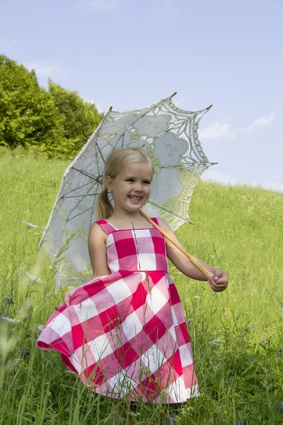 Girl with a summer umbrella — Stock Photo, Image