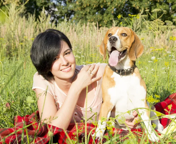 Girl with a dog in the park — Stock Photo, Image