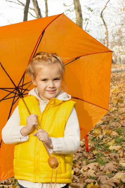 Beautiful girl hiding under an umbrella — Stock Photo, Image