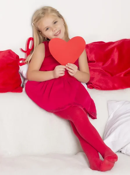 Girl in a holding a heart — Stock Photo, Image