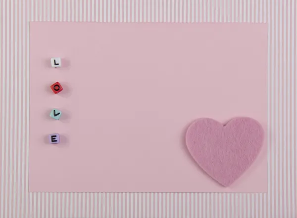 Aşk sembolü ile kart — Stok fotoğraf