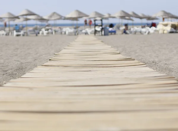 Wooden walkway to the sea — Stock Photo, Image
