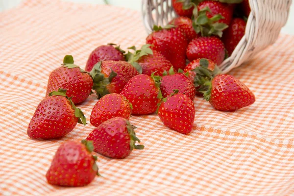 Strawberries lying on the orange napkin — Stock Photo, Image