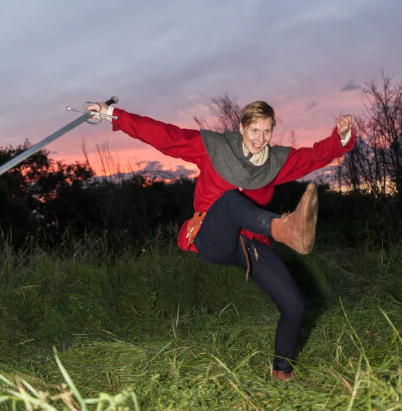 Knights fighting with swords in the last rays of the sun — Stock Photo, Image