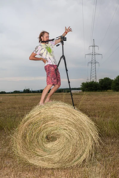 Fotograf auf dem Feld in der Krippe — Stockfoto