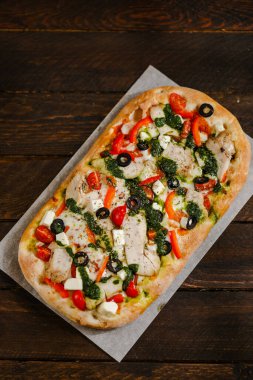 Pizza with pears tomatoes cheese Parmesan