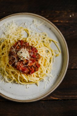 Sea products pasta with pepper and cheese Parmesan and sauce and tomatoes 
