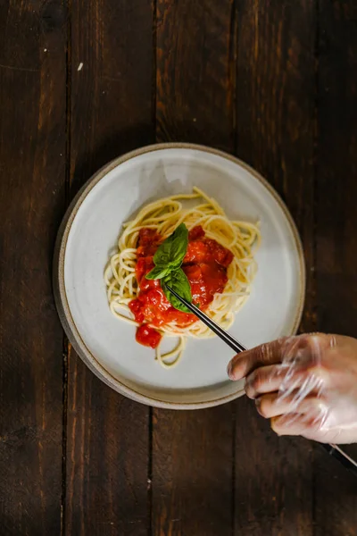 Sea products pasta with pepper and cheese Parmesan and sauce and tomatoes 