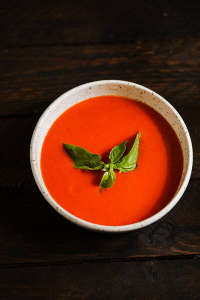 Cream soup with mushrooms pumpkin and tomatoes 