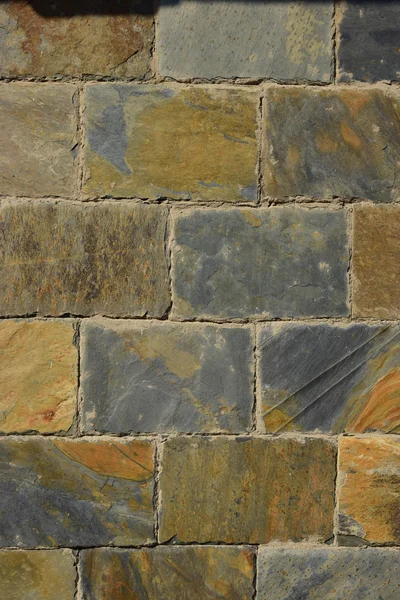 Vägg av färgstarka sten block — Stockfoto