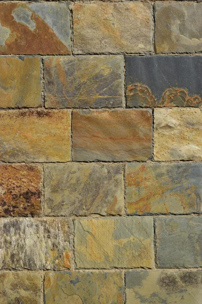 カラフルな石のブロックで作られた壁 — ストック写真