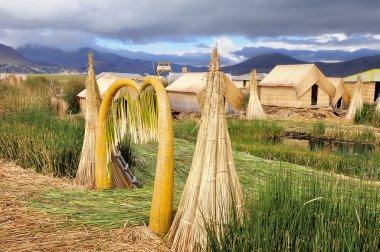 Small houses on Uros islands. clipart