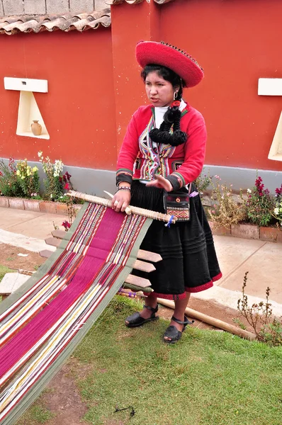 Woman shows process of making of the clothes. — Stock Photo, Image