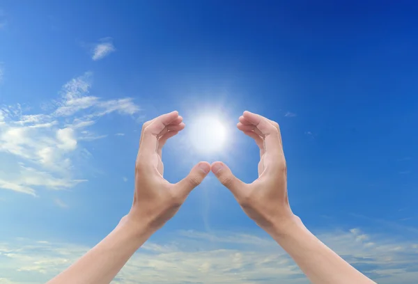 Hand sun and blue sky with copyspace — Stock Photo, Image