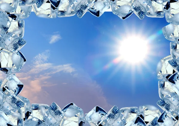 Ice cubes frame in blue sky