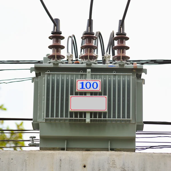 Electric transformer on some power concrete pole. — Stock Photo, Image