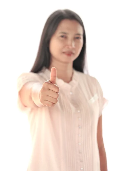 Portrait of young female showing a success sign against white — Stock Photo, Image