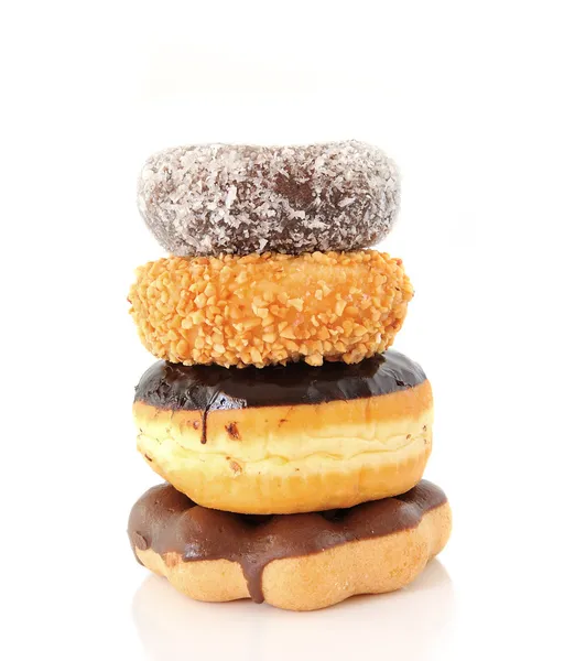 Uma pilha de donuts em um fundo branco — Fotografia de Stock