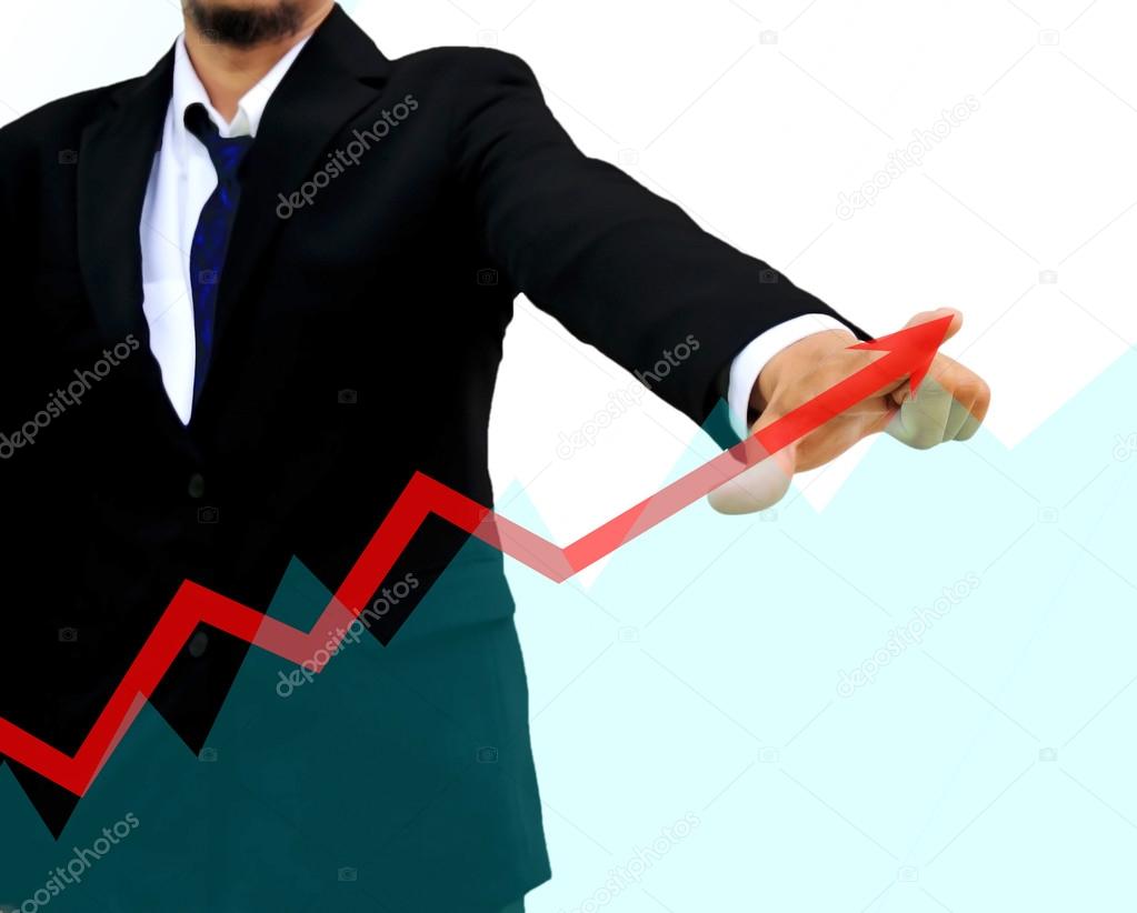 Businessman drawing a rising arrow . business growth Concept.