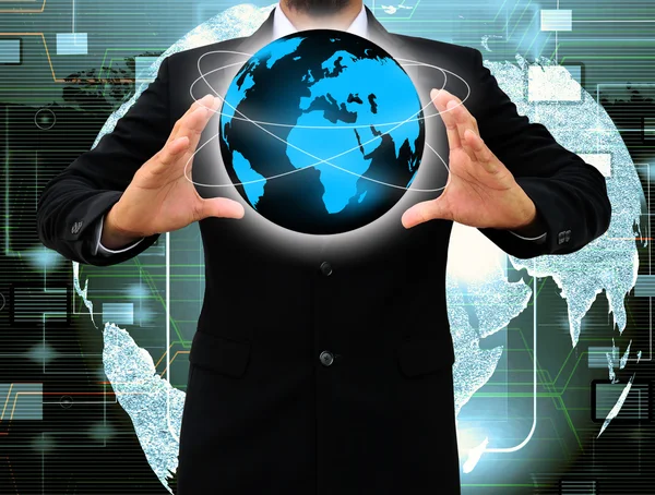 Podnikatel ruka drží svět — Stock fotografie