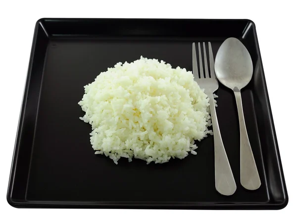 Rice in black plate. — Stock Photo, Image