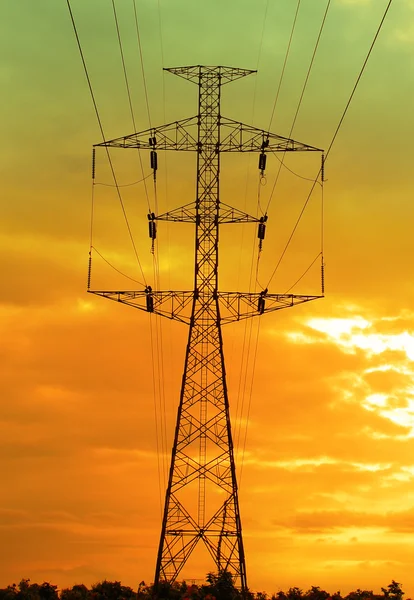 Electricity pylons at sunset — Stock Photo, Image