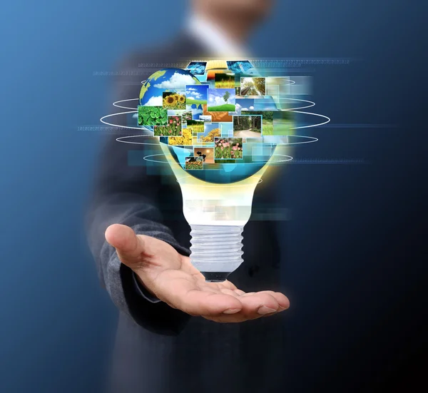 Business man holding light bulb Social Network — Stock Photo, Image