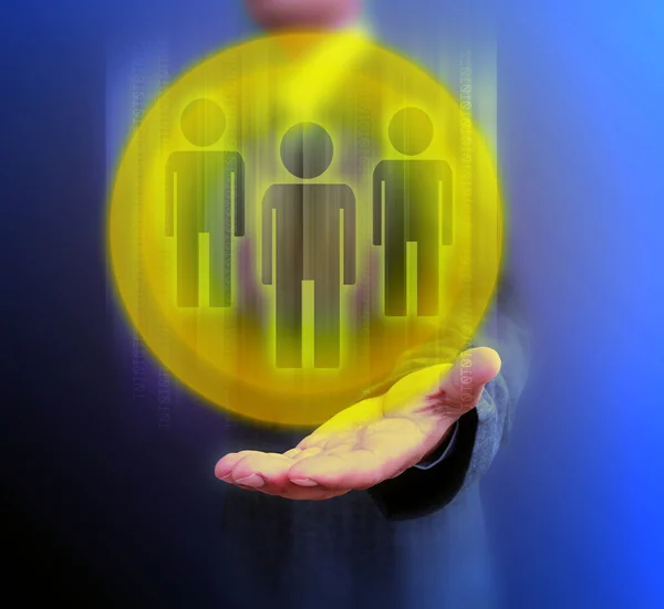 Бизнесмен держит в руках икону человека — стоковое фото