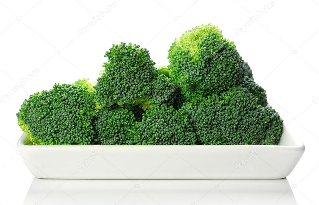 Fresh broccoli on white plate