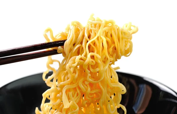 Chopsticks holding noodles isolated on white background — Stock Photo, Image