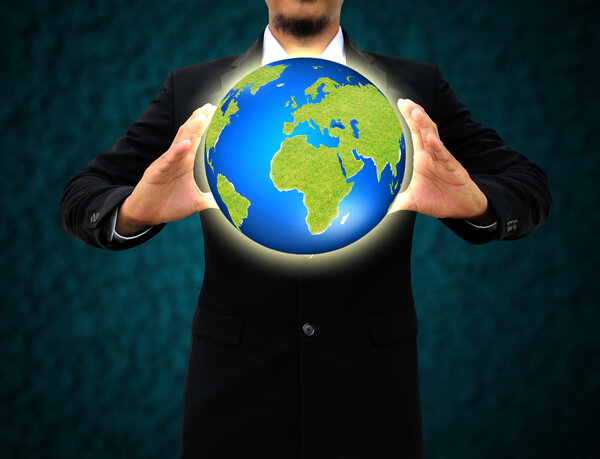 businessman holding green Earth in hands .Environmental concept