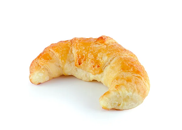 Fräsch och välsmakande croissant över vit bakgrund — Stockfoto
