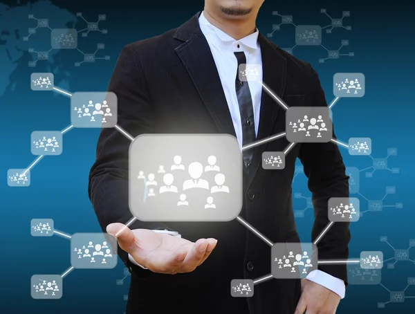 Businessman holding icon of social network — Stock Photo, Image