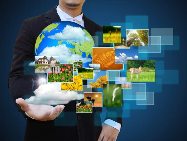 Businessman holding green Earth in hands — Stock Photo, Image