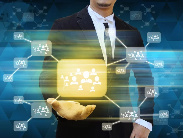 Businessman holding icon of social network — Stock Photo, Image